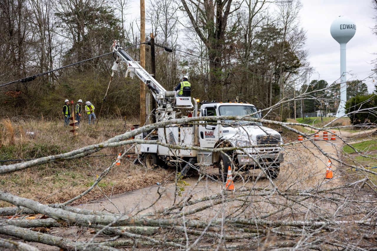 Crews work to restore power near Cemetary Road and Wallace Drive in Edwards, Mississippi.